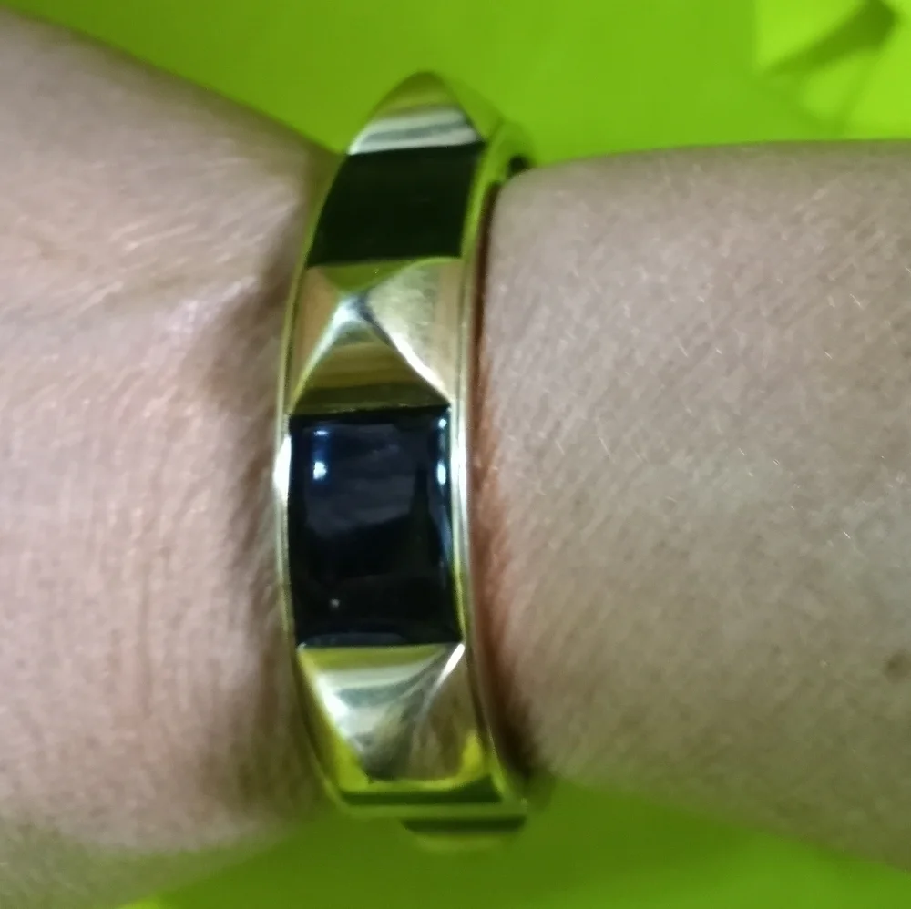 Goldtone pyramids Black hinged bracelet